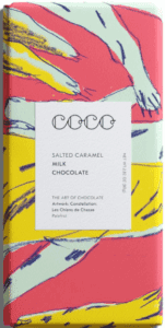 A colorful book titled 'Coco' about salted caramel, milk, and chocolate.