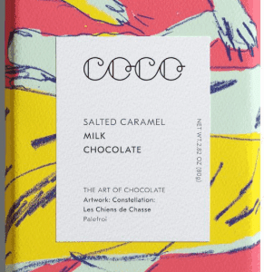 A colorful book titled 'Coco' about salted caramel, milk, and chocolate.